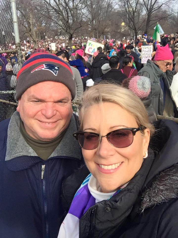 Elizabeth and Stephen at Women's March in large crowd of pink pussy hats